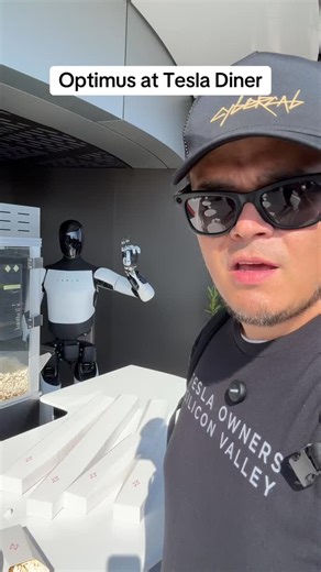 Tesla Optimus serves me popcorn at the Tesla Diner #fyp #tesla #optimus #tesladiner #teslarobot | Tesla Owners of Silicon Valley