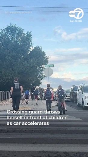 A crossing guard in Utah jumped into action when a vehicle suddenly accelerated toward two children riding scooters through a crosswalk. Video shows Tara Sandstrom rushing in front of the children and demanding the driver stop, saying her instinct was simply to protect the kids and keep everyone safe. The moment has since gone viral, with viewers praising her quick response.