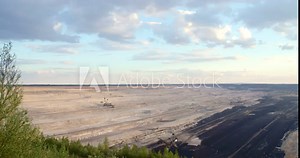 Giant Brown Coal Mine with Bucket Wheel Excavator. Shoot on Digital Cinema Camera in 4k - ProRes 422 codec