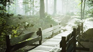 old wooden bridge over a small stream in a park