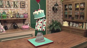 3.1K views · 103 reactions | You can learn to create a gravity defying topsy cake for only $1! Our detailed video tutorial will teach you every single step, including: building the internal structure, creating tilted tiers, decorating the cakes, floating balloon and more. These techniques can be applied to an infinite number of other designs. The sky is the limit! | SugarEd Productions | Facebook
