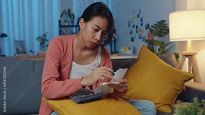 Asia lady feel stress worried with bill and invoice credit card calculating money on sofa at home at night. Home loan stress, Get loan no job, Coronavirus hardship loans, Can't make payment concept. Stock Video
