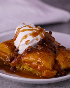 We turned biscuits into a custardy bread pudding bake and finished with a praline sauce that's so good, we made it into its own recipe. Praline Bread Pudding recipe: https://www.pillsbury.com/recipes/praline-bread-pudding/dddcabe0-f05f-4c56-b737-60cce7ed3cd0?utm_source=facebook_organic&utm_medium=social&utm_campaign=MSP_03_2019_standard | Pillsbury