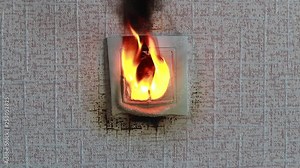 socket close-up. The fire was caused by a short circuit. Electric short curcuit. the fire is real