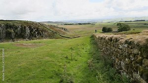 England Scotland Hadrians Wall scenic landscape. Hadrian's Wall was a defensive fortification in the Roman province of Britannia built in AD 122. One of Britain's major ancient tourist attractions.