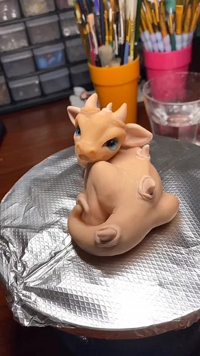 I’m in love with this color shift paint! #wip #tutorials #dragon #colorshift #paintingchallenge #miniatures #sculptingclay