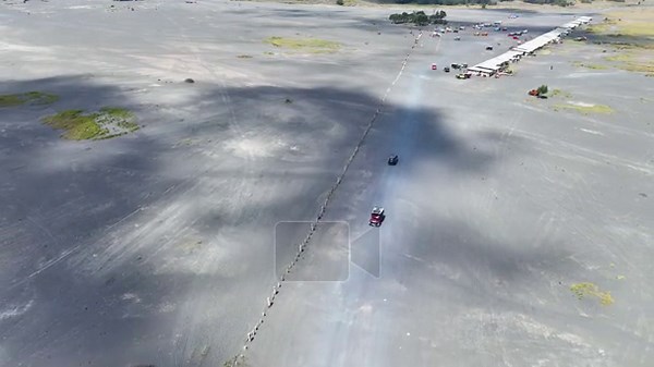 Drone view of the Bromo volcano road filled with hundreds of colorful jeeps lined up neatly waiting for the queue to get off to continue the journey, Tengger Semeru national park, East Java, Indonesia Stock Video Footage - Alamy