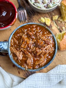 This slow cooker BBQ pork and beans recipe fills the house with comforting smells and fills your belly without breaking your budget or your energy. Toss everything in the slow cooker and come back to a sweet and savory Southern favorite your family will love. ✅ Comment PORK AND BEANS and I’ll DM it over! https://www.backtomysouthernroots.com/slow-cooker-bbq-pork-and-beans/ #ad #sponsoredpost #USAPork #UtahPork | Back To My Southern Roots