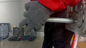 worker Thread Marking conduit pipe for Electrical work . hands hold or make threader on pipe galvanized by using Hand Pipe Threader Die Tool set. Industrial skill.