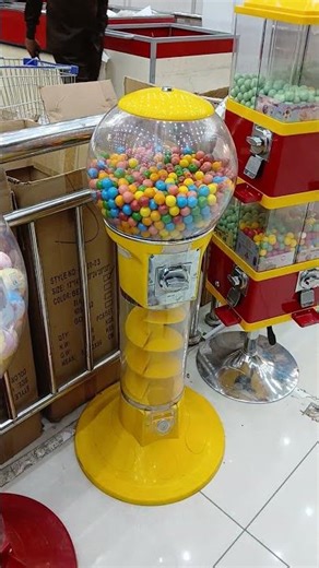 Look at this yellow gumball machine dispenser with assorted colors candy inside #shorts