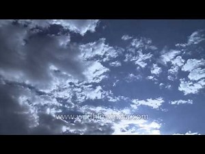 Clouds moving in fast motion over the American cities - Time Lapse