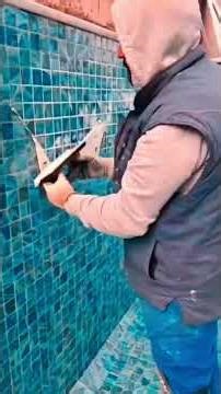 Precise and professional installation of 5x5 cm pool mosaic tiles