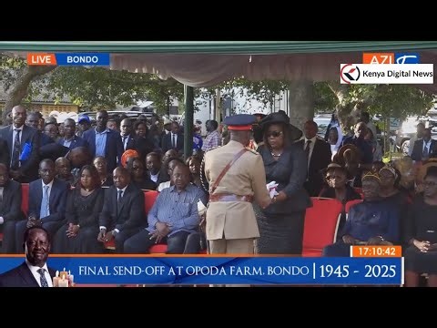 Ida Odinga receives the Kenyan flag from the military as a symbol of Raila's service to the nation