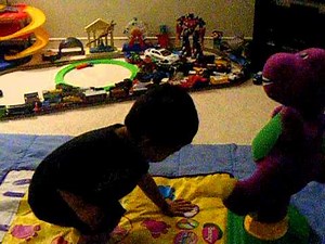 Joseph Playing the Barney move and groove dance mat