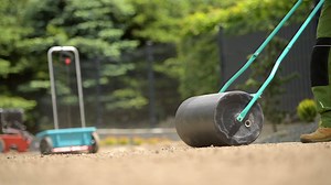Compacting Soil Using Lawn Roller