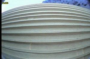 Space shuttle launch from the perspective of a solid rocket booster after detachment.