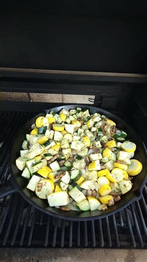 using the 16" cast iron frying pan on bbq yellow squash, zucchini, onions, garlic butter, mushrooms