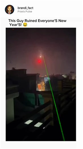 Lift ⚜️ on Instagram: "The post shares a 20-second video of a man on a rooftop using a visible green laser pointer to precisely target and prematurely detonate ascending New Year's fireworks, creating colorful mid-air bursts amid a cityscape display, framed humorously as spoiling the festivities."