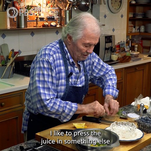 Elevate your summer blueberries with Jacques Pépin's simple recipe! [VID: Jacques Pépin cooking in his kitchen. Transcript: Hi. I'm Jacques Pépin, and this is "American Masters: At Home." I love blueberries in full summer. I do different recipes with it. Usually pretty simple. I have a quarter of a cup of sugar here for like 12 ounces of berries, which is for four people, easy. So, what I like to put with the berry here is a chiffonade of mint. And I think it goes so well with it. So, I'm cuttin