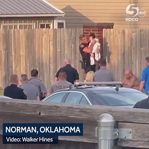HOSTAGE SITUATION ENDS | This video taken by a neighbor shows the moment a 2-year-old child was taken peacefully by police, after being held hostage by her father for hours in Norman. Here's the latest >> https://bit.ly/3B4v3BF (🎥: Christine Stanwood via Walker Hines) | KOCO 5 News