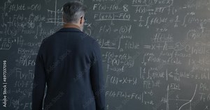 Back view of man professor walking to blackboard and underlining maths formula thinking about science development. Education and mathematics concept.