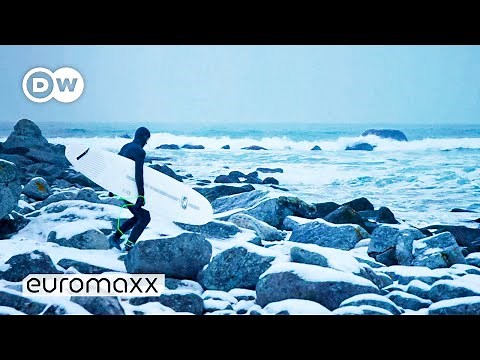 Arctic Surfing In The Freezing Waters Of The Lofoten Islands In Norway