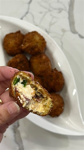 Jalapeño popper bites are the perfect crispy cheesy bite. Incredibly easy to make and so addictive! 1/2 cup diced jalapeño 8 ounce soften cream cheese 1/2 cup mayo 1/4 tsp Salt 1/4 tsp pepper 1/4 tsp garlic powder 1/2 cup cooked diced turkey bacon 1 cup shredded cheddar cheese 1/4 cup Italian seasoned bread crumbs 1/4 cup panko breadcrumbs 2 Eggs 1/2 cup all purpose flour Vegetable oil for frying In a bowl combine softened cream cheese, jalapeño, turkey bacon, seasoning, mayo and shredded chedda