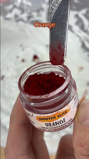 Using orange dry food coloring to tint meringue #macarons #meringue #baking #foodcoloring