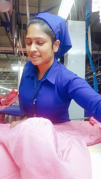 Textile Manufacturing: Folding Pink Fabric Process