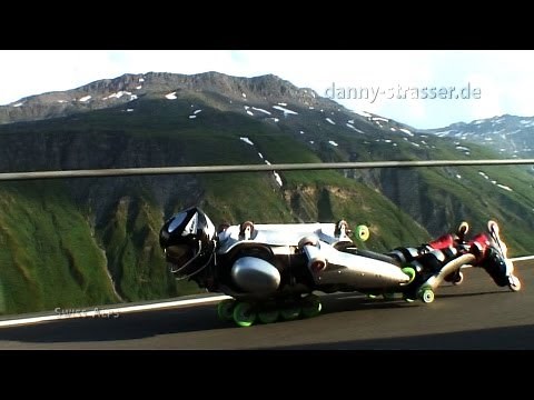 Downhill extreme: Rollerman overtaking motorcycle!