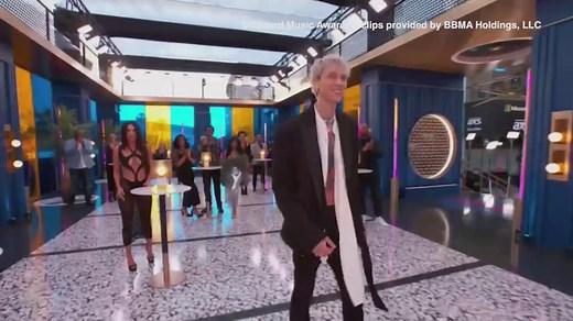 Machine Gun Kelly shares a kiss with Megan Fox at 2021 BBMAs