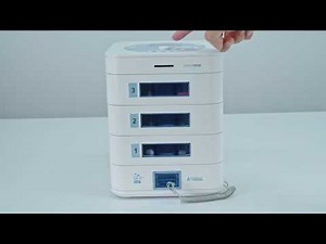 How to configure all layers of the automatic pill dispenser to dispense medication simultaneously?