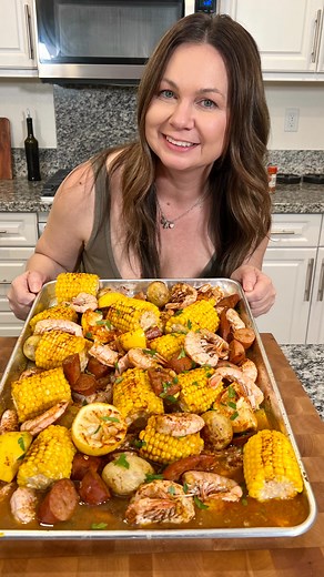 Ryan Armendariz on Instagram: "1 PAN SHRIMP BROIL! 🦐 Host the easiest mess free shrimp broil this summer using a sheet pan! I used cooked frozen shrimp, frozen bag of corn, cajun style andouille sausage, golden round potatoes (I stuck potatoes in microwave for about 3 minutes before adding to sheet pan) fresh lemon juice and 1 stick of butter. Season with your fav Cajun seasoning. Stick in oven for about 15 minutes at 375! #summerhosting #shrimpbroil"