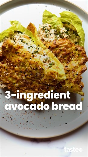 Turn that ripe avo into bread! Just add an egg, some cheese, herbs and seasonings to create a delicious gluten-free bread. And if the thought of eating warm avocado has you running for the hills, never fear. The cheese provides most of the flavour (and those important crispy edges) here. For the full recipe, Google ‘Taste 3-ingredient avocado bread’. Recipe by @elisa_pie #glutenfreerecipe #glutenfreerecipes #glutenfreebread #avocadobread | Taste.com.au