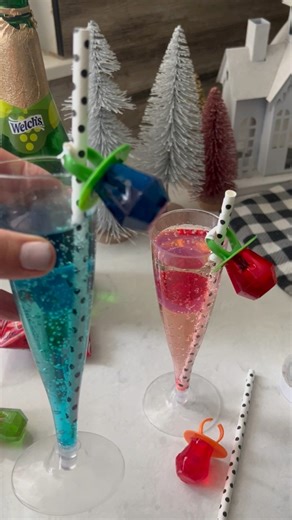 Ring in the New Year with the cutest mocktail ever! 🥂💍 I used a fun glass, added a sparkling drink, topped it with a ring pop, and even hung another ring pop from the straw for extra flair. Perfect for kids or a festive twist on your NYE drinks! Full recipe/details in the comments. #NYEMocktail #RingPopDrink #KidsDrinks #HolidayFun #SparklingTreat | Kid Friendly Things To Do