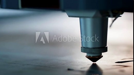 Industrial laser cutter in action, close-up of the metal cutting process, the laser beam smoothly cuts the part, leaving a clear and clean edge, emphasizing high precision.