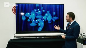 Watch this 65" TV roll up like a yoga mat