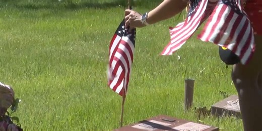 Honoring soldier’s graves with flags