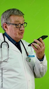 Doctor in white coat holding smartphone and records voice message, voice commands, messaging.