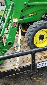John Deere 3032E loaded, tie down spots.