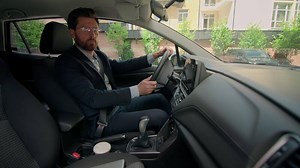 Caucasian man guy male driver auto owner businessman driving sit inside modern luxury car turn steering wheel urban parking city drive automobile go to work travel rent buy vehicle transport insurance