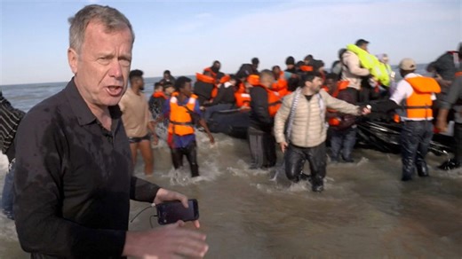 Watch: French police wade into sea to slash migrant 'taxi-boat'