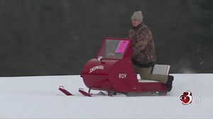 Vintage snowmobiles on display