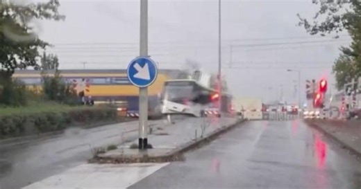 Train slams bus sitting on Dutch railroad crossing