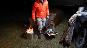 Friendship and fire: A warm campfire on a cold, rainy night