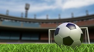 Football background, soccer ball on the grass at stadium. 3d animation