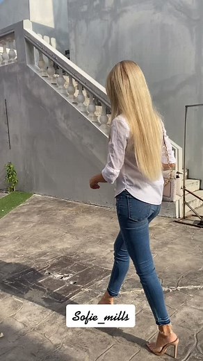 Sofie Mills Walking in Style Towards Love Building