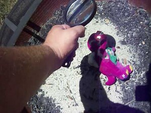 Burning Plush Barney Doll With Magnifying Glass