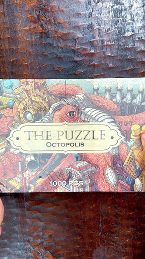 David Minkin on Instagram: "This is the world’s most difficult jigsaw puzzle, Octopolis by @hungryminds.the.book. 🧩 The artwork is intricate, but it’s really more about the shape and cut of the pieces. 🧐 Normally, I begin a puzzle by finding all of the border pieces and getting those set, but this puzzle has lots of areas of straight lines within it so flat edges don’t mean a piece is a border. 🤨 I really did not expect it to be as difficult as it was. What I thought would take the better par