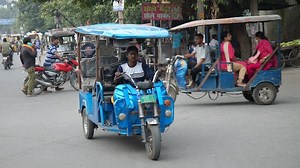 Battery-powered rickshaws spark electric vehicle revolution on India's streets